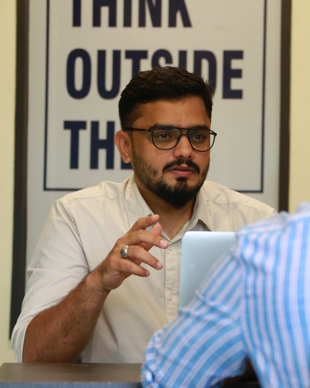 Ahmed Ashraf, founder of HAWKSEE, advising a client at the HAWKSEE office
