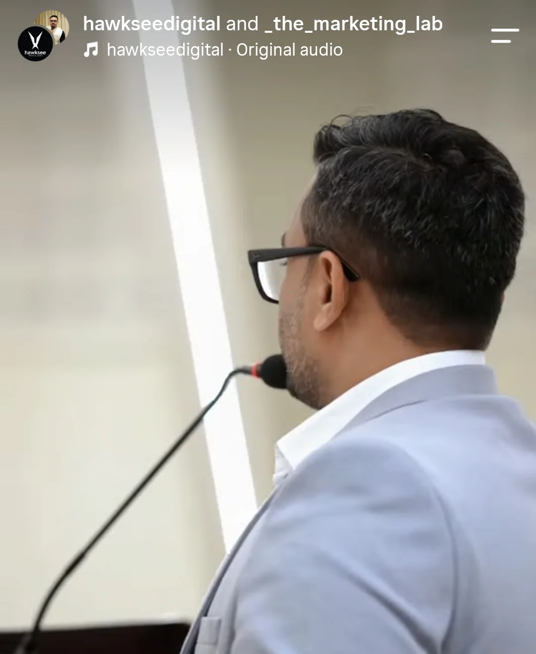 Ahmed Ashraf at the lectern during the workshop